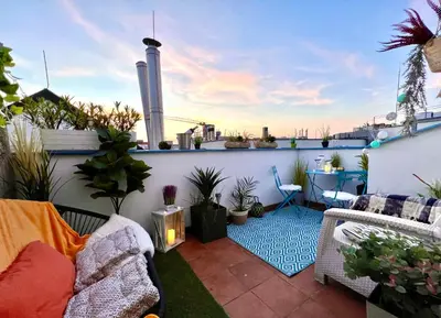 a rooftop patio with plants on a balcony at Duplex 2 with quiet terrace on Wenceslas Square in Prague
