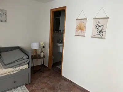 a room with a bed and two pictures on the wall at Old Town Square Apartments in Prague