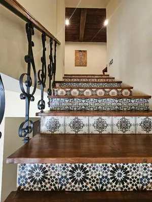 a set of stairs with mosaics on them at Hotel Galerie in Roudnice nad Labem