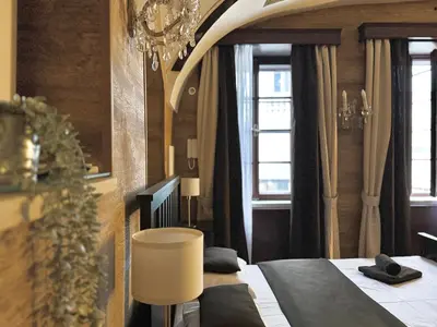 a living room with a couch and a table at Unique Prague Apartment in Prague
