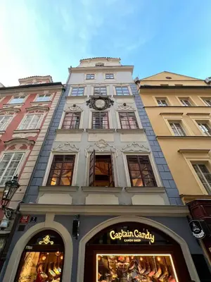 a tall building with a clock on top of it at Unique Prague Apartment in Prague