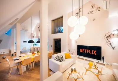 a living room with a white couch and a table at LUX Penthouse Apartments near Wenceslas Square in Prague