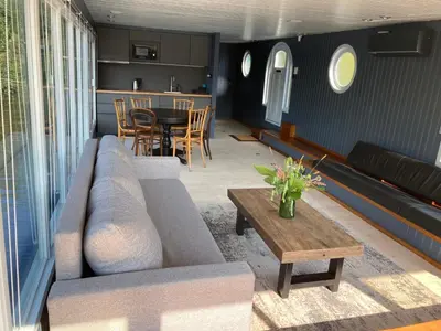a living room with a couch and a table at Houseboat - best place in Prague in Prague