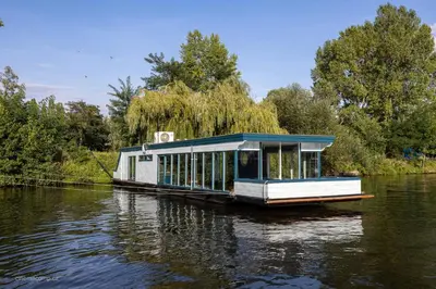 a house boat floating on a river at Houseboat - best place in Prague in Prague