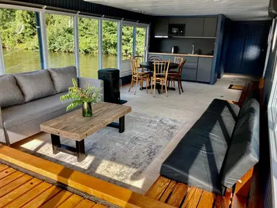 a living room with a couch and a table at Houseboat - best place in Prague in Prague
