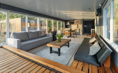 a living room with a couch and a table at Houseboat - best place in Prague in Prague