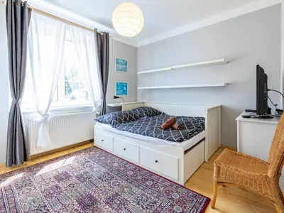 a bedroom with a bed with a teddy bear on it at Holiday Home Řevnice by Interhome in Řevnice