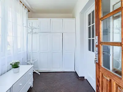 a room with white cabinets and a door at Holiday Home Řevnice by Interhome in Řevnice