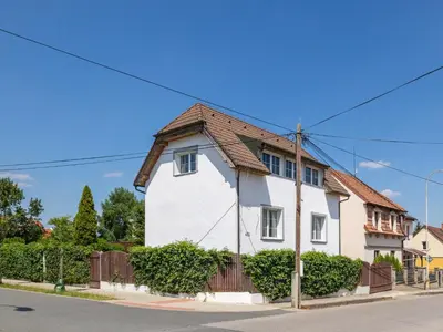a white house with a brown roof at Holiday Home Řevnice by Interhome in Řevnice