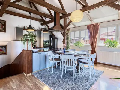 a kitchen and dining room with a table and chairs at Holiday Home Řevnice by Interhome in Řevnice