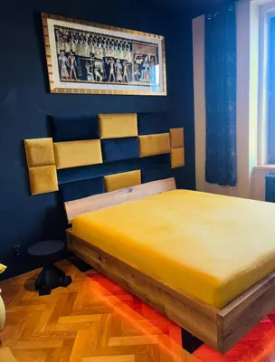 a bedroom with a large bed in a room at Wenceslas square apartment 150 m2 in Prague