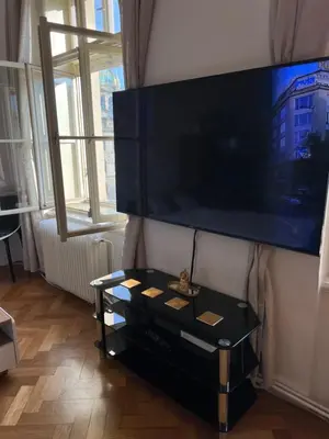 a flat screen tv on a wall in a living room at Wenceslas square apartment 150 m2 in Prague