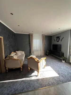 a living room with two beds and a television at Apartmány Pekárna 1898 in Beroun