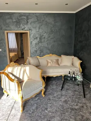 a living room with a couch and a table at Apartmány Pekárna 1898 in Beroun