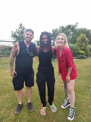 a group of three people standing in a field at Paradise villa apartment in Prague