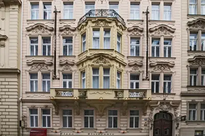 a large building with a balcony on the side of it at Numa Prague Flow in Prague
