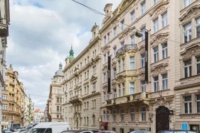 a row of tall buildings on a city street at Numa Prague Flow in Prague