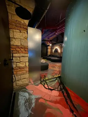 an empty room with a brick wall and a door at SPA SPA Opletalova in Prague