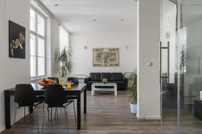 a living room with a table and a couch at Prague Days - Open-plan Studio with AC near National Theatre in Prague