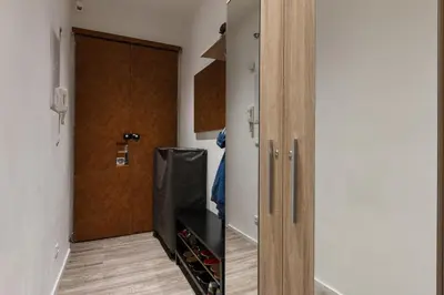 a room with a closet with a door and a room with a door at Prague Days - Open-plan Studio with AC near National Theatre in Prague