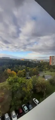 a view of cars parked in a parking lot at Apartment Kamýk in Prague