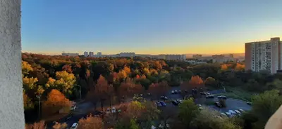 an aerial view of a park with trees and buildings at Apartment Kamýk in Prague