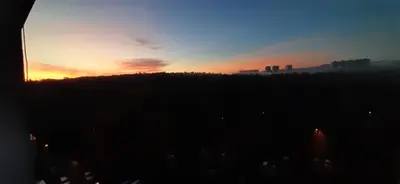 a sunset with a city in the background at Apartment Kamýk in Prague