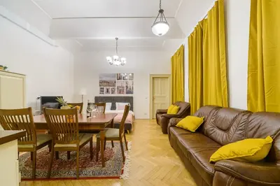 a living room with a couch and a table at Superb apartments near Dlouha street in Prague