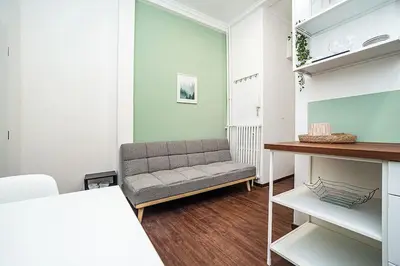a living room with a couch and a table at Cozy Old Town Stay - 1-bedroom apartment in Prague