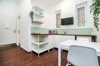 a room with a desk and a table and a tv at Cozy Old Town Stay - 1-bedroom apartment in Prague