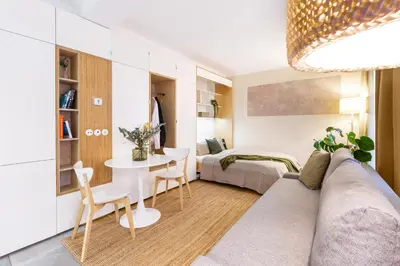a living room with a couch and a table at TurnKey I Studio by Amazing Park in Prague