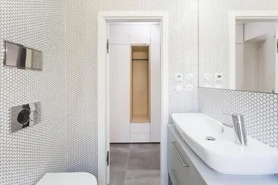 a white bathroom with a sink and a toilet at TurnKey I Studio by Amazing Park in Prague