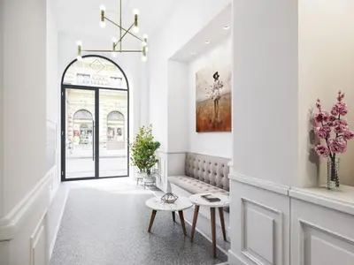 a black kitchen with a sink and a plant at TurnKey I Premium Apartment in Prague