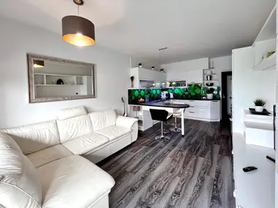 a living room with a white couch and a table at British Quarter Apartments in Prague