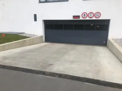 a garage with two clocks on the side of a building at Apartmantplus02 in Prague