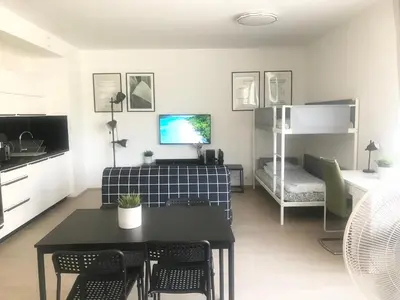 a living room with a couch and a table at Apartmantplus02 in Prague