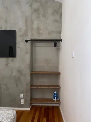 a room with a closet with wooden shelves at Stylish studio apartment by Namesti Miru in Prague