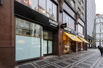 a group of buildings on a city street at Numa Prague Poise in Prague