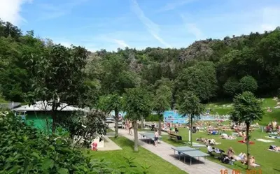a group of people sitting in a park at Jana's apartment, free parking in Prague
