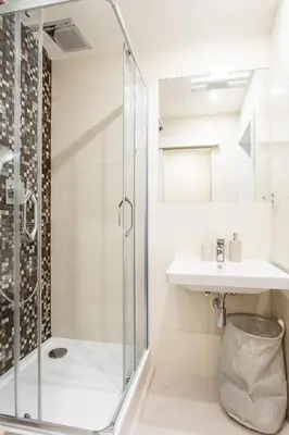 a bathroom with a shower and a sink at Cozy modern studio in Prague's absolute center in Prague