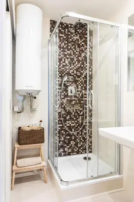 a shower with a glass door in a bathroom at Cozy modern studio in Prague's absolute center in Prague