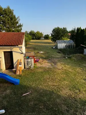 a yard with a house and a playground at Apartmán Jenčice v Českém středohoří in Jenčice