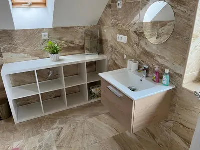a bathroom with a sink and a mirror at Apartmán Jenčice v Českém středohoří in Jenčice