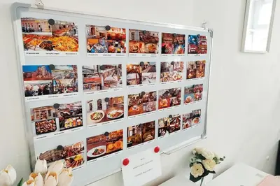 a wall with pictures of food on it at Balcony King Suite 12 min from Charles Bridge in Prague