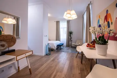 a living room with a kitchen and a dining room at Modern Downtown APT - renovated, on ideal location in Prague