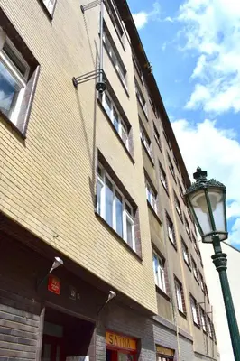 a building with a street light in front of it at Old Town Konviktská - Bohemian Residence in Prague
