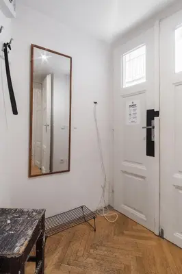 a mirror on a wall next to a door at Prague Days - Apartment with Chill Zone right next to Wenceslas Square in Prague