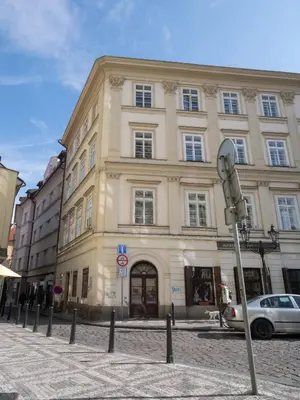 a large building on a street with a car in front at Prague Days - Apartment with Chill Zone right next to Wenceslas Square in Prague