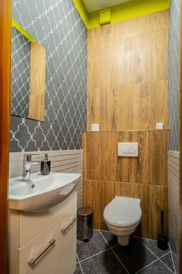 a bathroom with a white sink and a toilet at National Museum 3BDR Golden Stork Spot in Prague