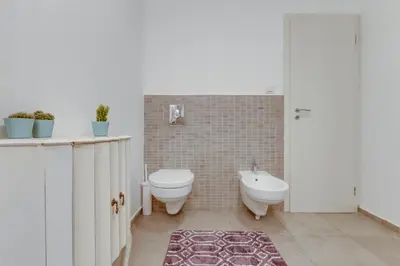 a bathroom with a toilet and a bidet at Spacious stylish attic in the heart of the center - Karlovo in Prague